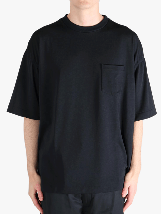 Black t-shirt worn by a person, showing the t-shirt's fit