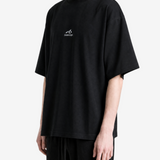 Black t-shirt worn by a person, showing the t-shirt fit