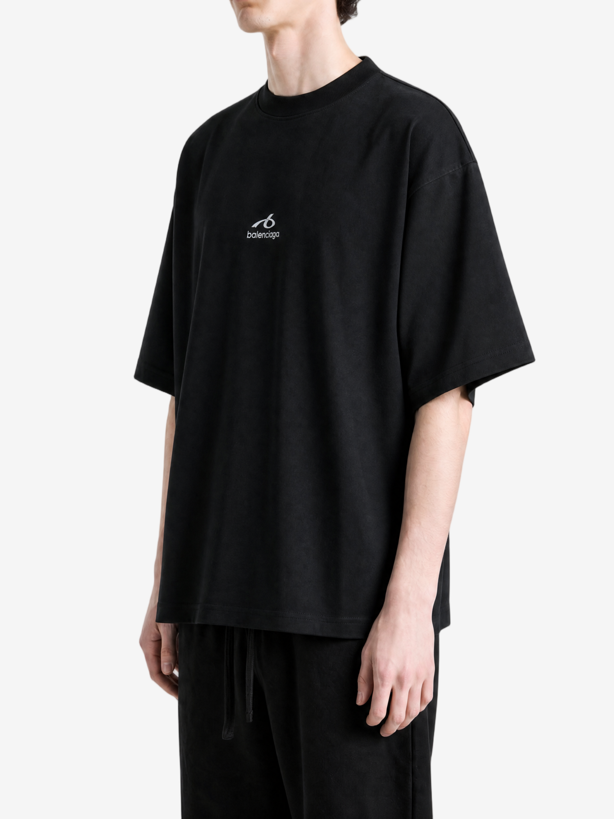 Black t-shirt worn by a person, showing the t-shirt fit