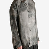 Grey shirt worn by a person, showing the shirt's it