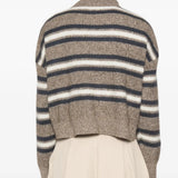 Tan hoodie worn by a person, showing the hoodie fit
