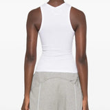 White top worn by a person, showing the top fit
