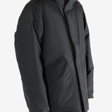 Black coat worn by a person,showing the coat fit