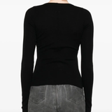 Black shirt worn by a person, showing the shirt fit