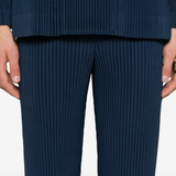 close up of blue pants, showing texture of the polyester fabric
