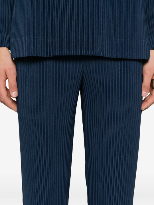 close up of blue pants, showing texture of the polyester fabric

