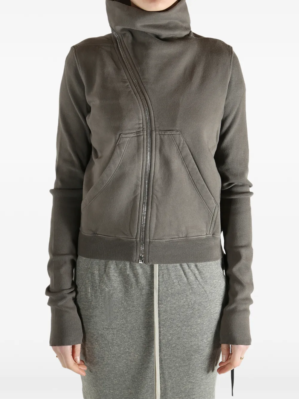 Grey sweat worn by a person, showing the sweat fit