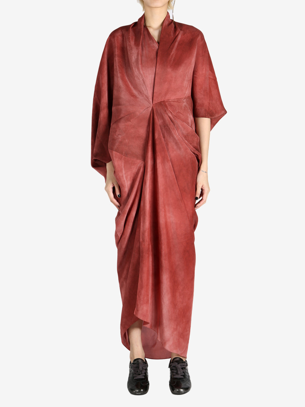 Red top worn by a person, showing the top's fit