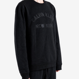 Black hoodie worn by a person, showing the hoodie fit