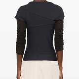 navy t-shirt worn by a person, showing the t-shirt fit