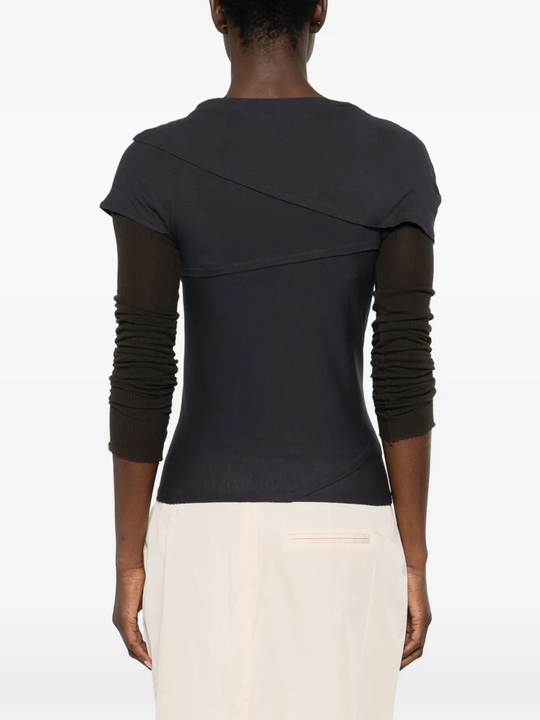 navy t-shirt worn by a person, showing the t-shirt fit