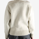 Tan sweater worn by a person, showing the sweater fit