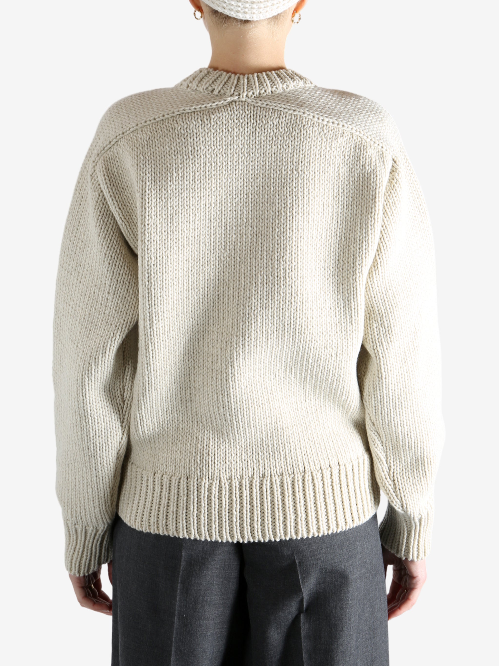 Tan sweater worn by a person, showing the sweater fit