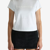 White t-shirt worn by a person, showing the shirt's fit