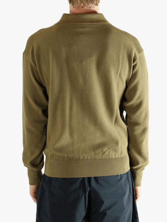 Green sweater worn by a person, showing the sweater fit