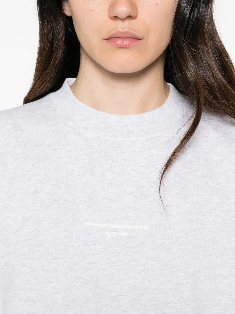 Grey t-shirt worn by a person, showing the t-shirt fit