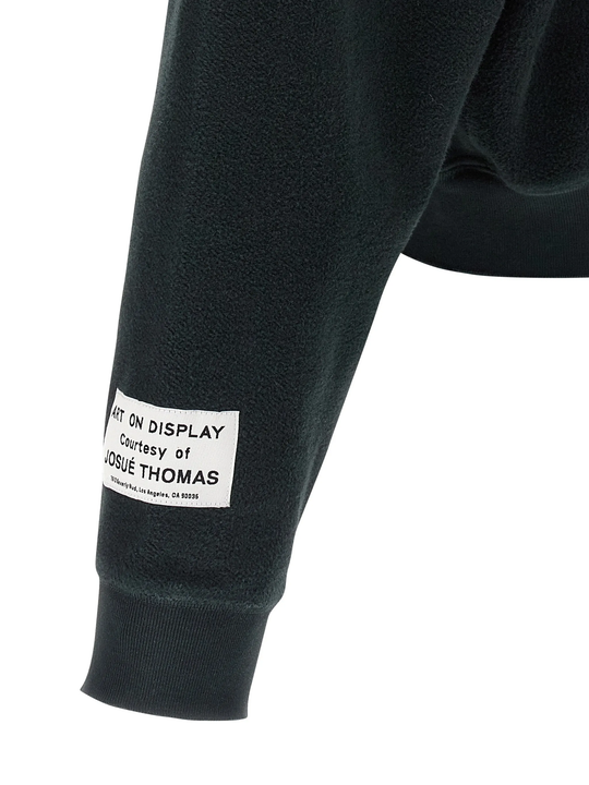 Close up of black jacket, showing texture of the cotton fabric