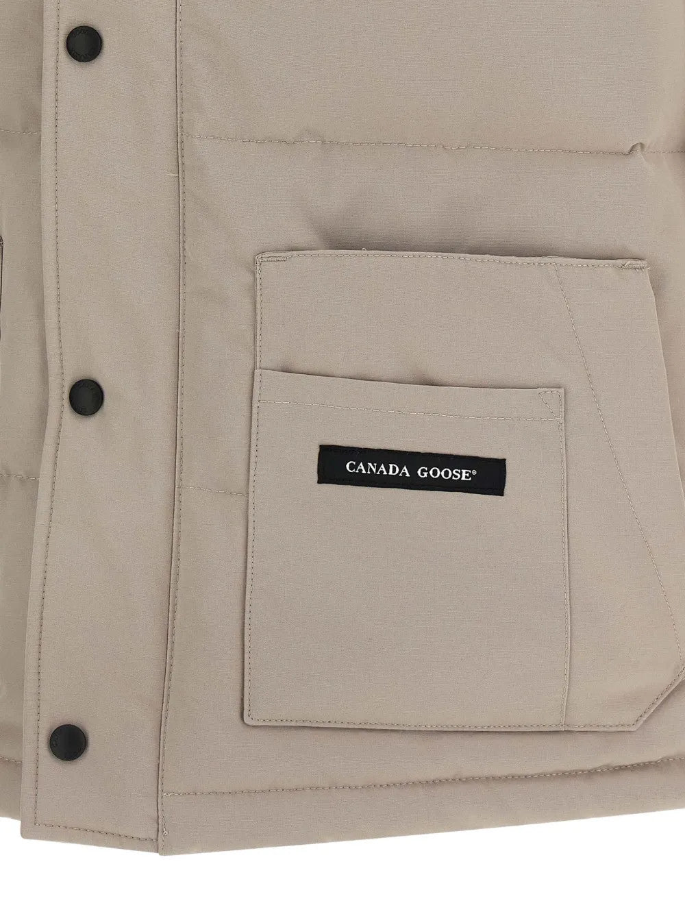 Close up of Tan jacket, showing texture of the 84% polyester/ 16% cotton fabric
