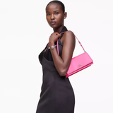 Pink bag worn by a person, showing the bag's fit