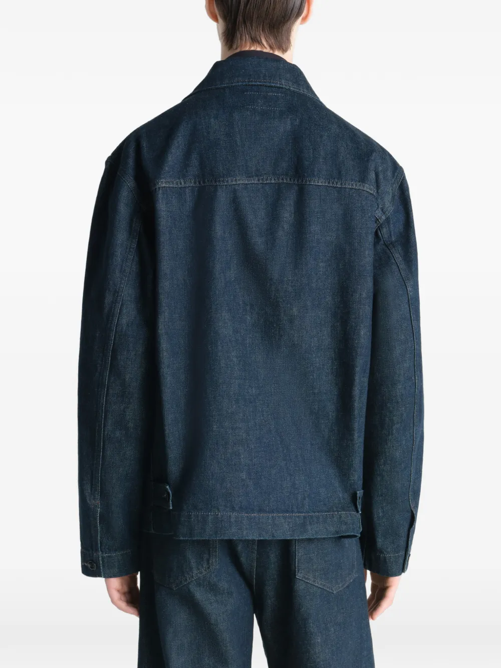 Blue jacket worn by a person, showing the jacket's fit