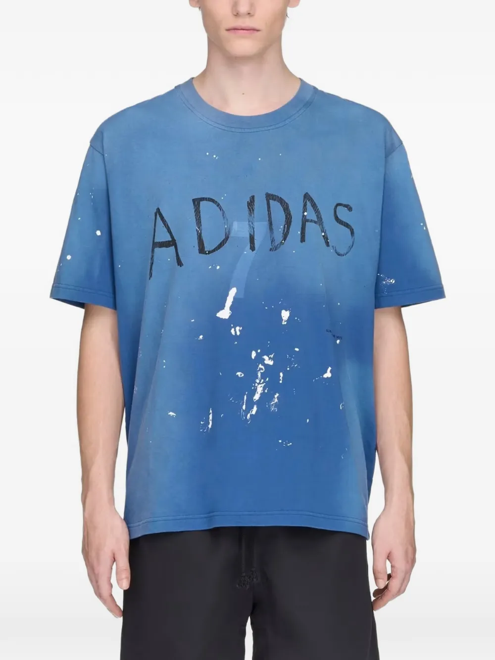 Blue t-shirt worn by a person, showing the t-shirt's fit