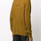 Brown knitwear worn by a person, showing the knitwear fit