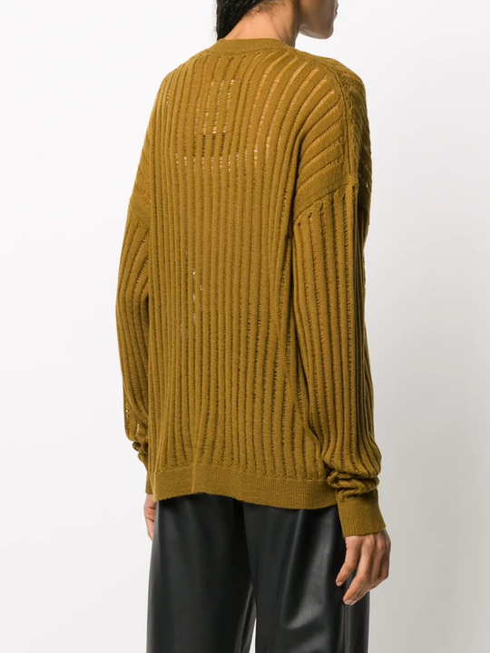 Brown knitwear worn by a person, showing the knitwear fit