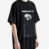 Black t-shirt worn by a person, showing the t-shirt fit
