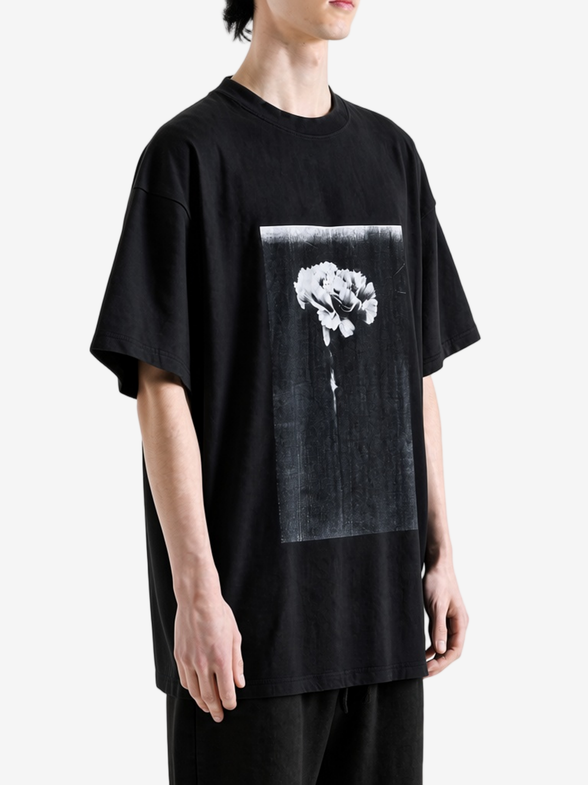 Black t-shirt worn by a person, showing the t-shirt fit