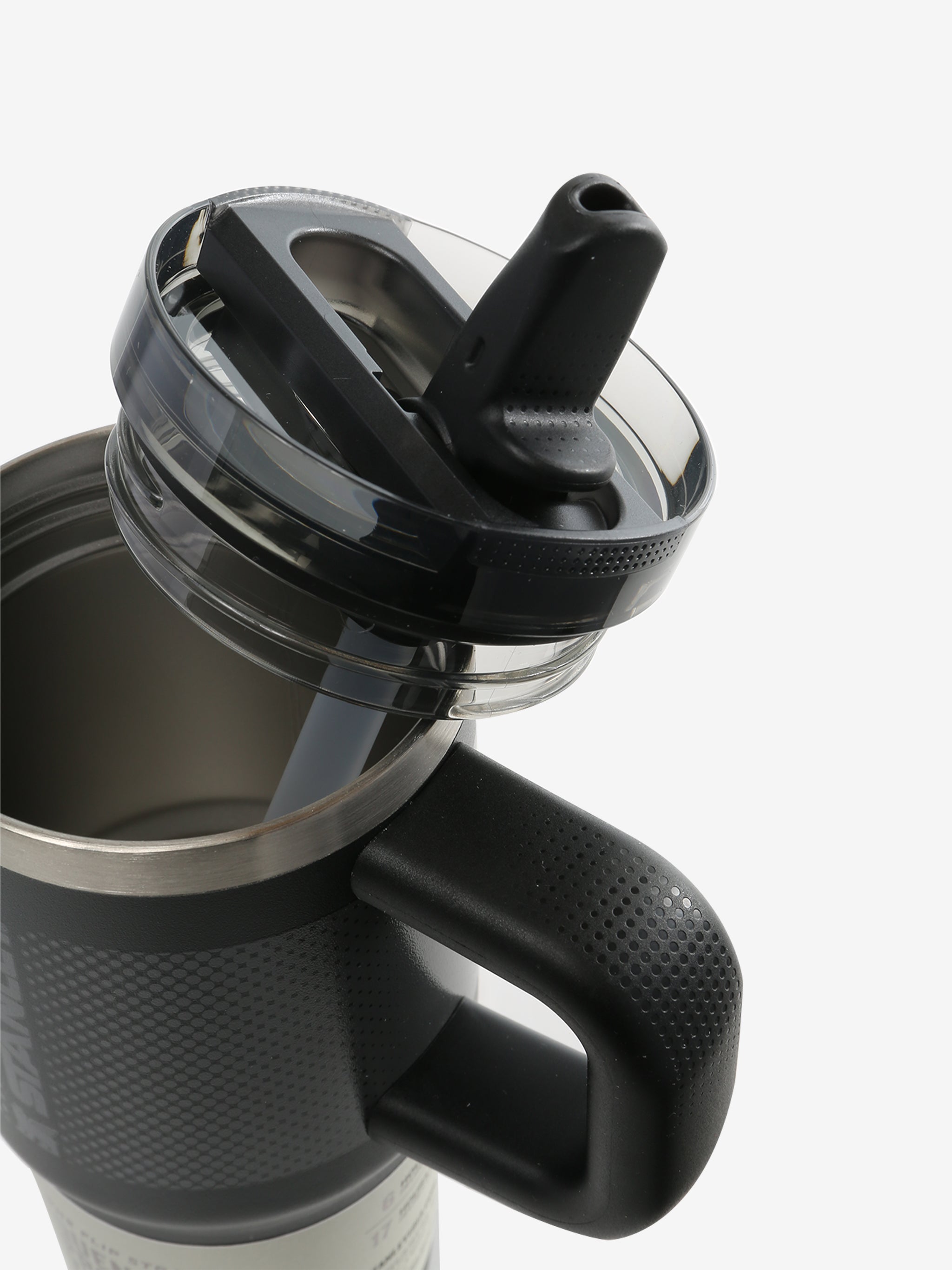 Close up of black tumbler, showing texture of the lid and straw