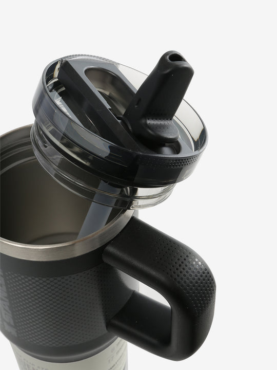 Close up of black tumbler, showing texture of the lid and straw