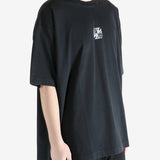 Black t-shirt worn by a person, showing the t-shirt's fit