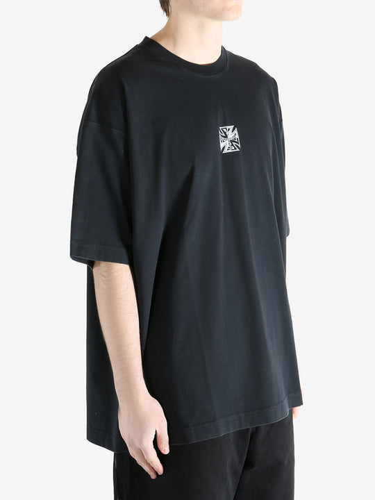 Black t-shirt worn by a person, showing the t-shirt's fit