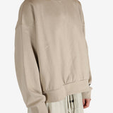 Tan hoodies worn by a person, showing the hoodies fit