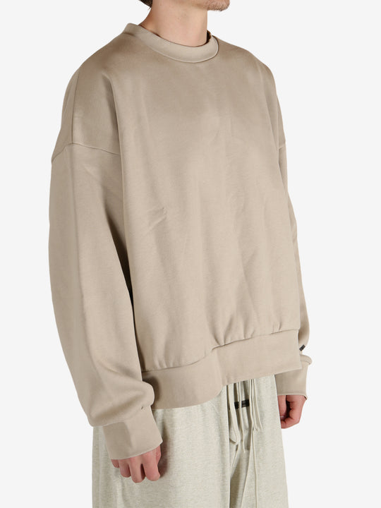 Tan hoodies worn by a person, showing the hoodies fit