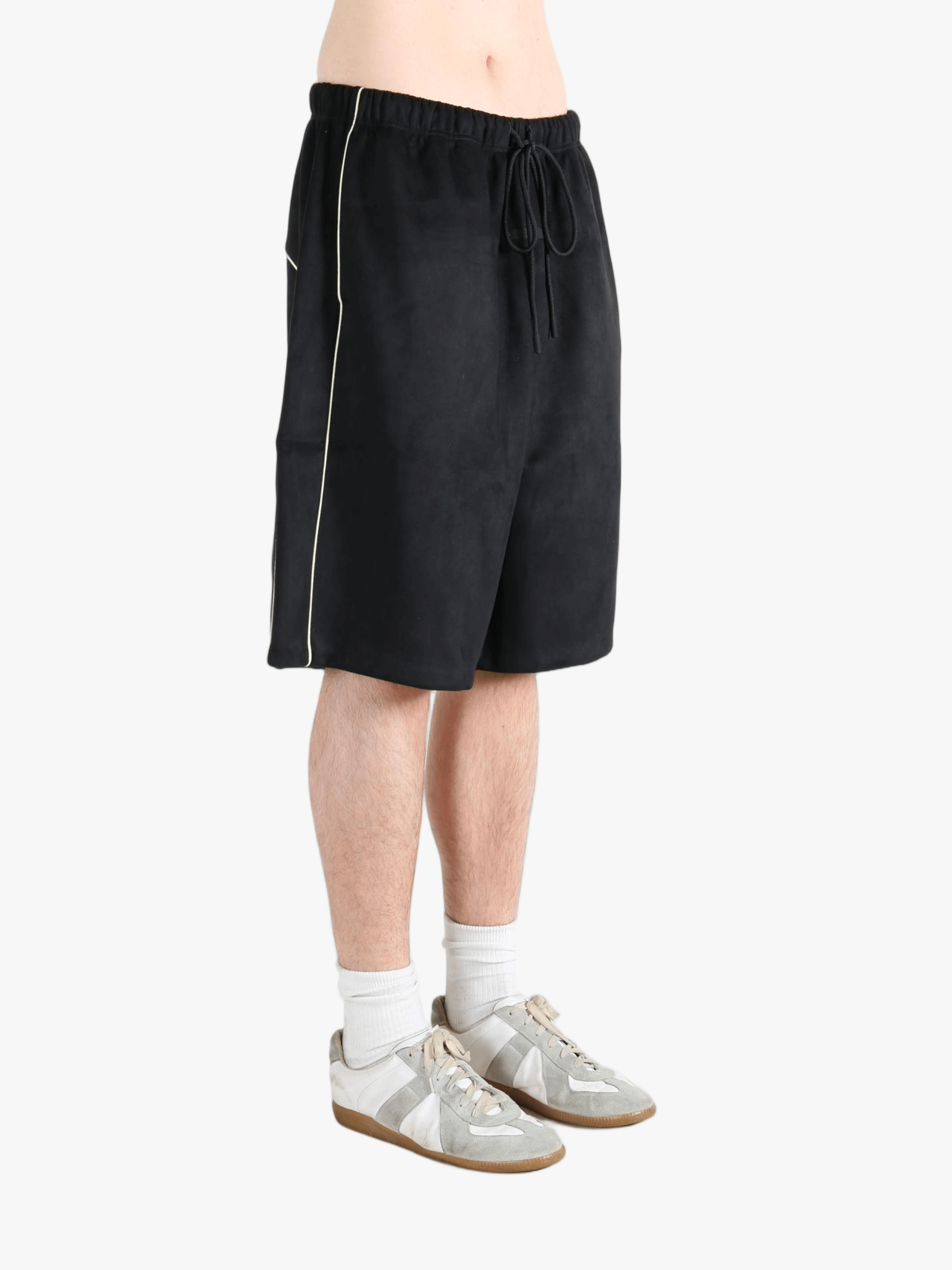 Black shorts worn by a person, showing the shorts fit