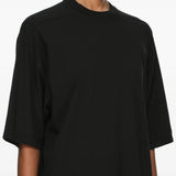 Black t-shirt worn by a person, showing the t-shirt fit