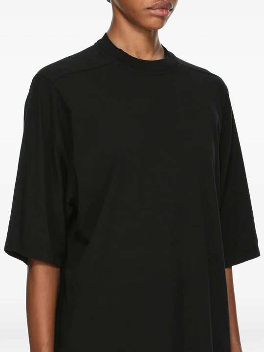 Black t-shirt worn by a person, showing the t-shirt fit