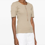 Tan shirt worn by a person, showing the shirt fit