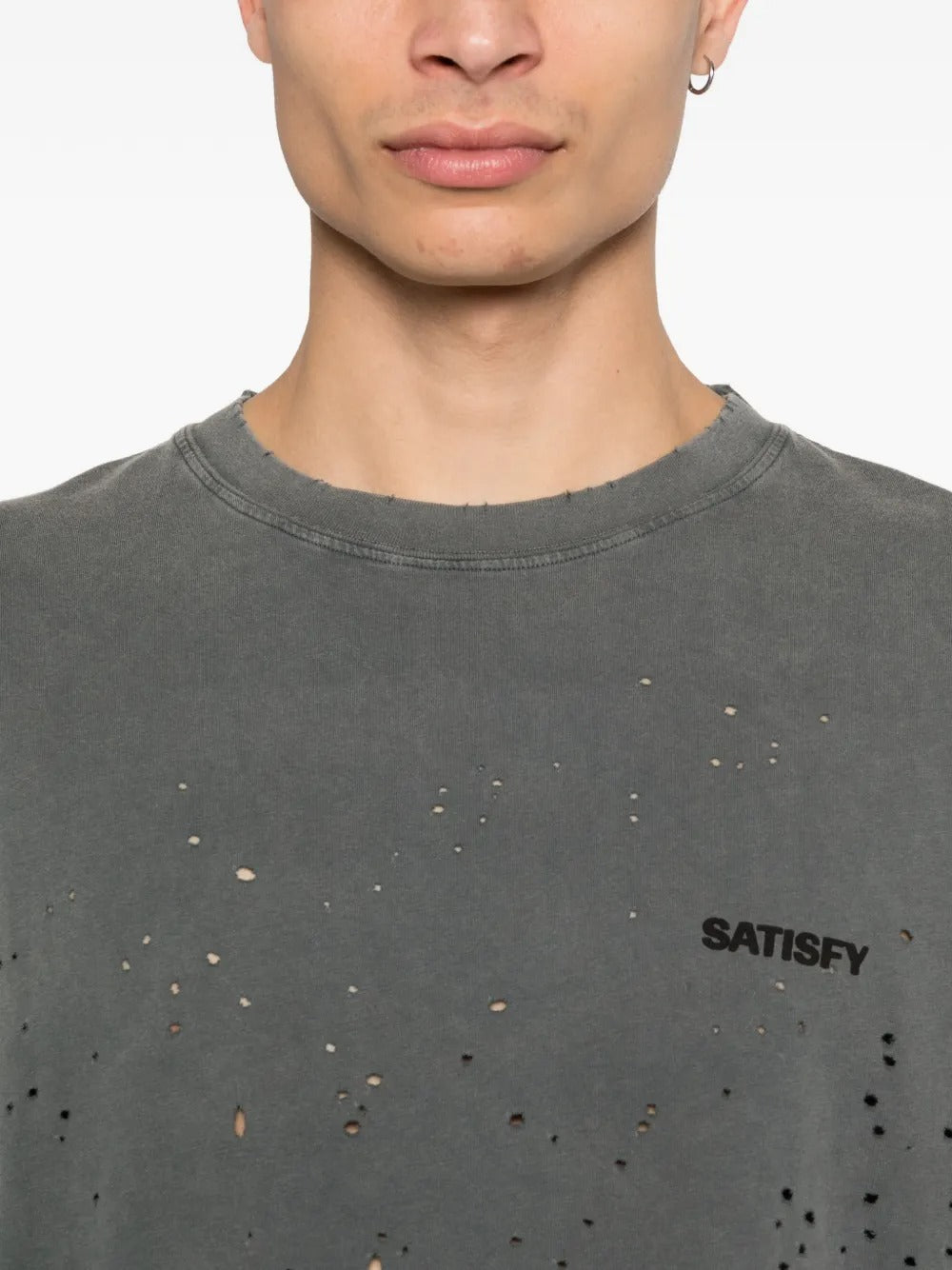 Close up of the black t-shirt, showing texture of the cotton fabric