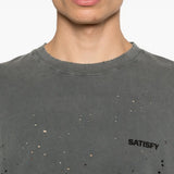 Close up of the black t-shirt, showing texture of the cotton fabric