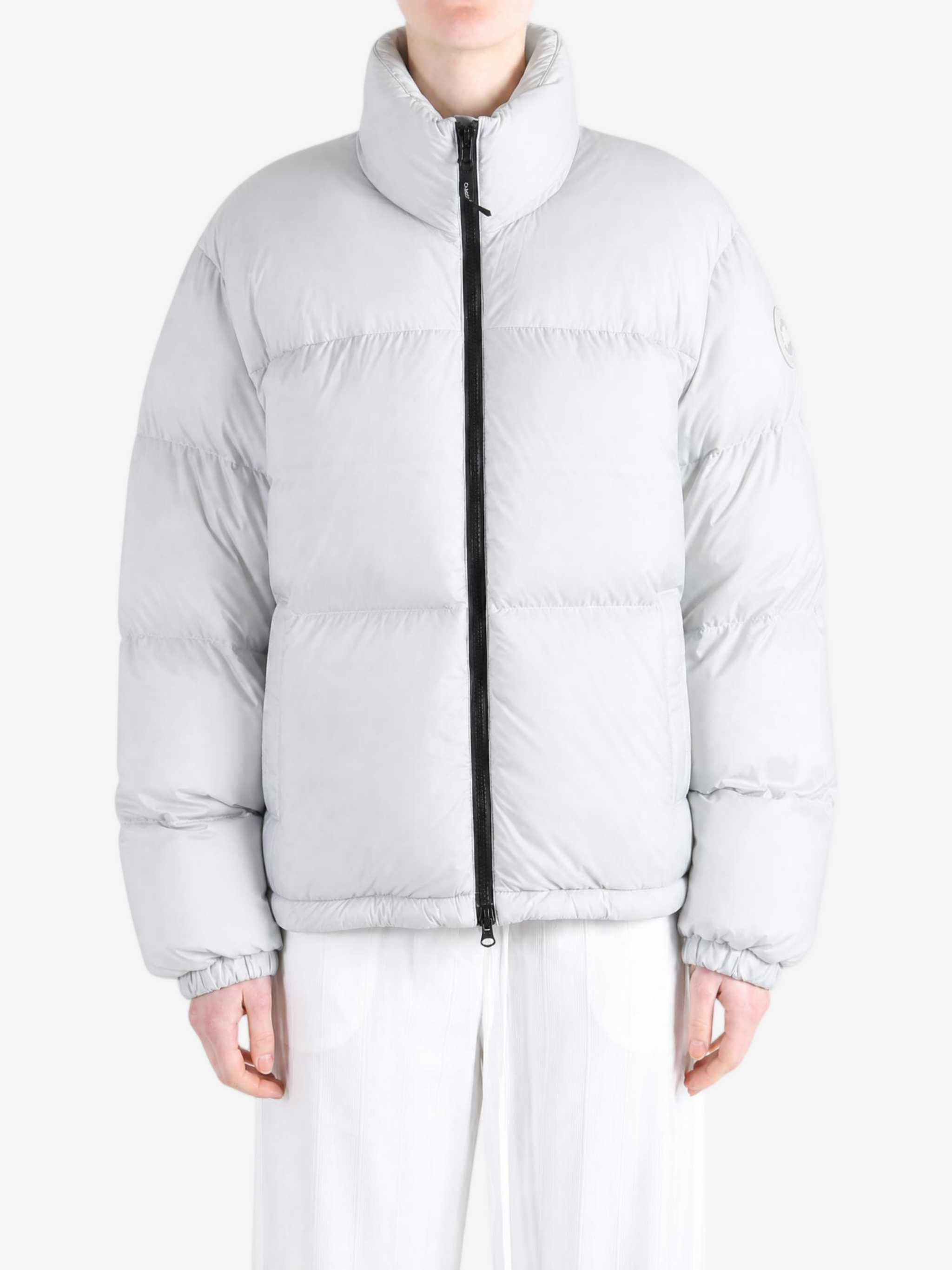 Grey jacket worn by a person, showing the jacket fit