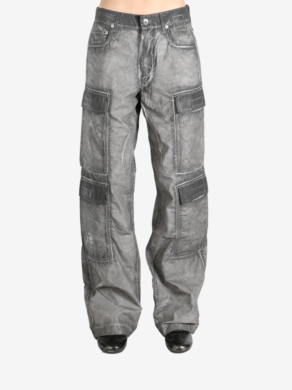 Grey jeans worn by a person, showing the jeans fit