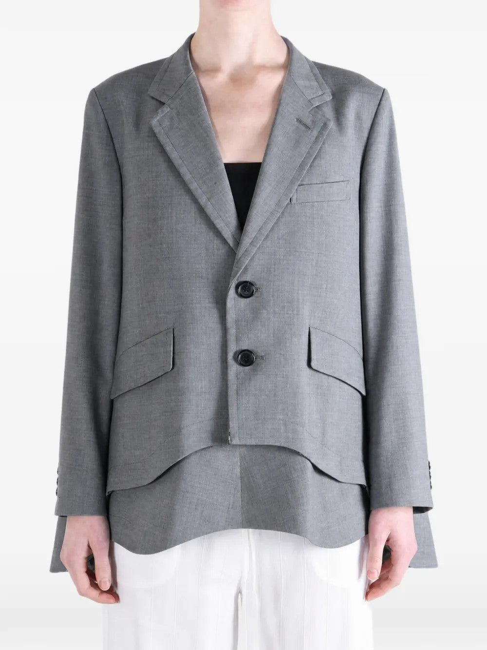 Grey jacket worn by a person, showing the jacket fit