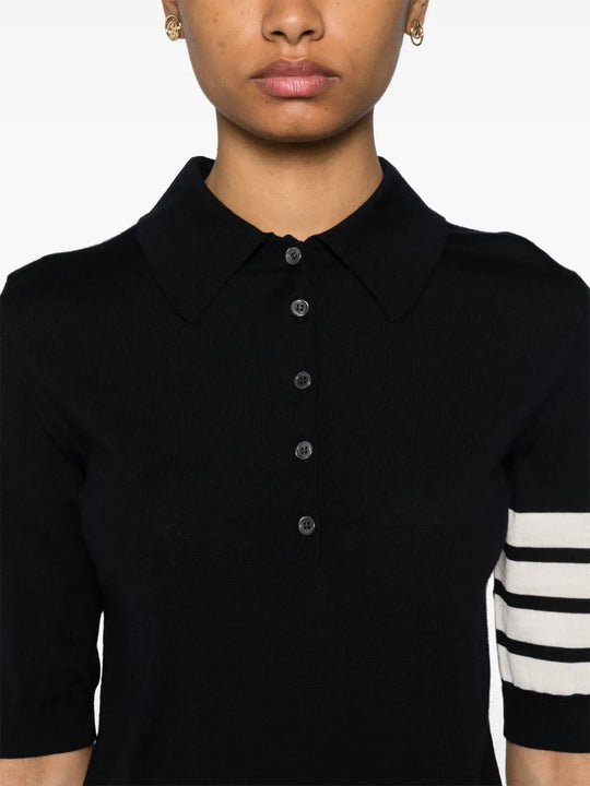 Black shirt worn by a person, showing the shirt fit