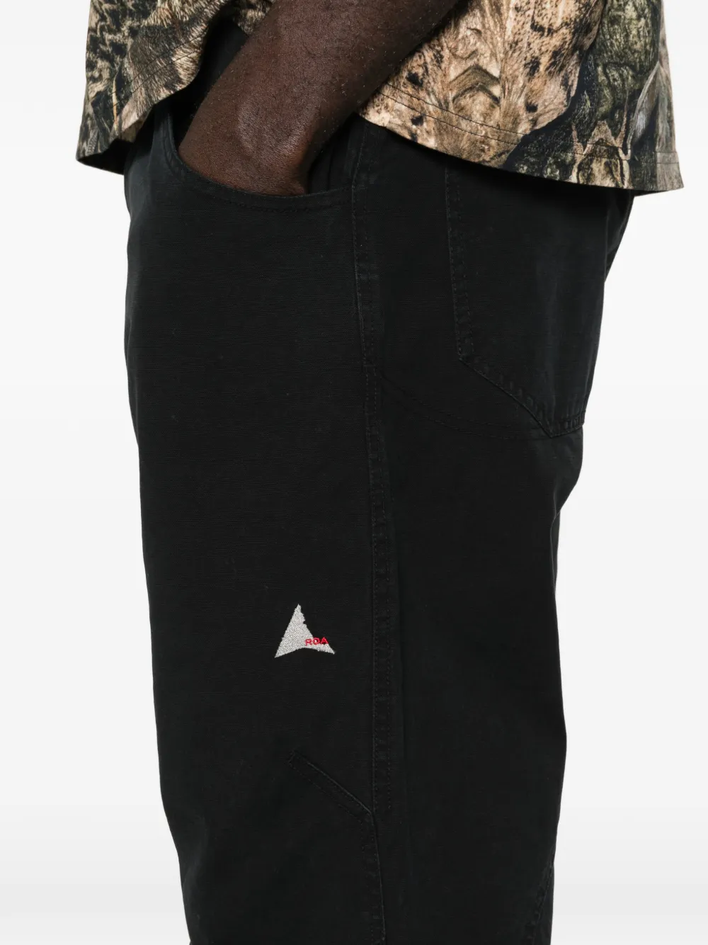 Close up of black pants, showing texture of the Cotton fabric