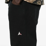 Close up of black pants, showing texture of the Cotton fabric