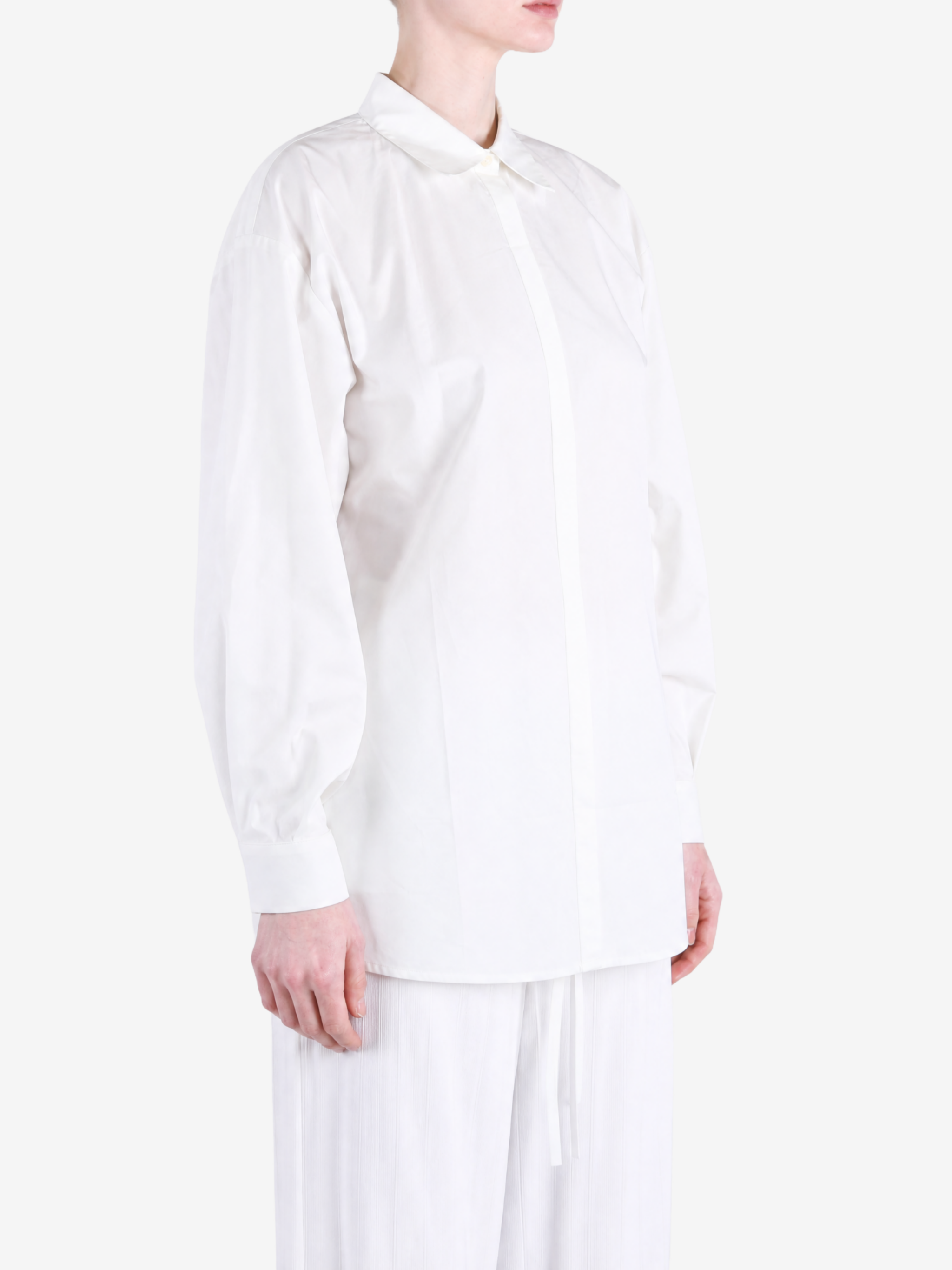 White shirt worn by a person, showing the shirt fit