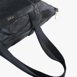 Close up of black bag, showing texture of the nylon fabric