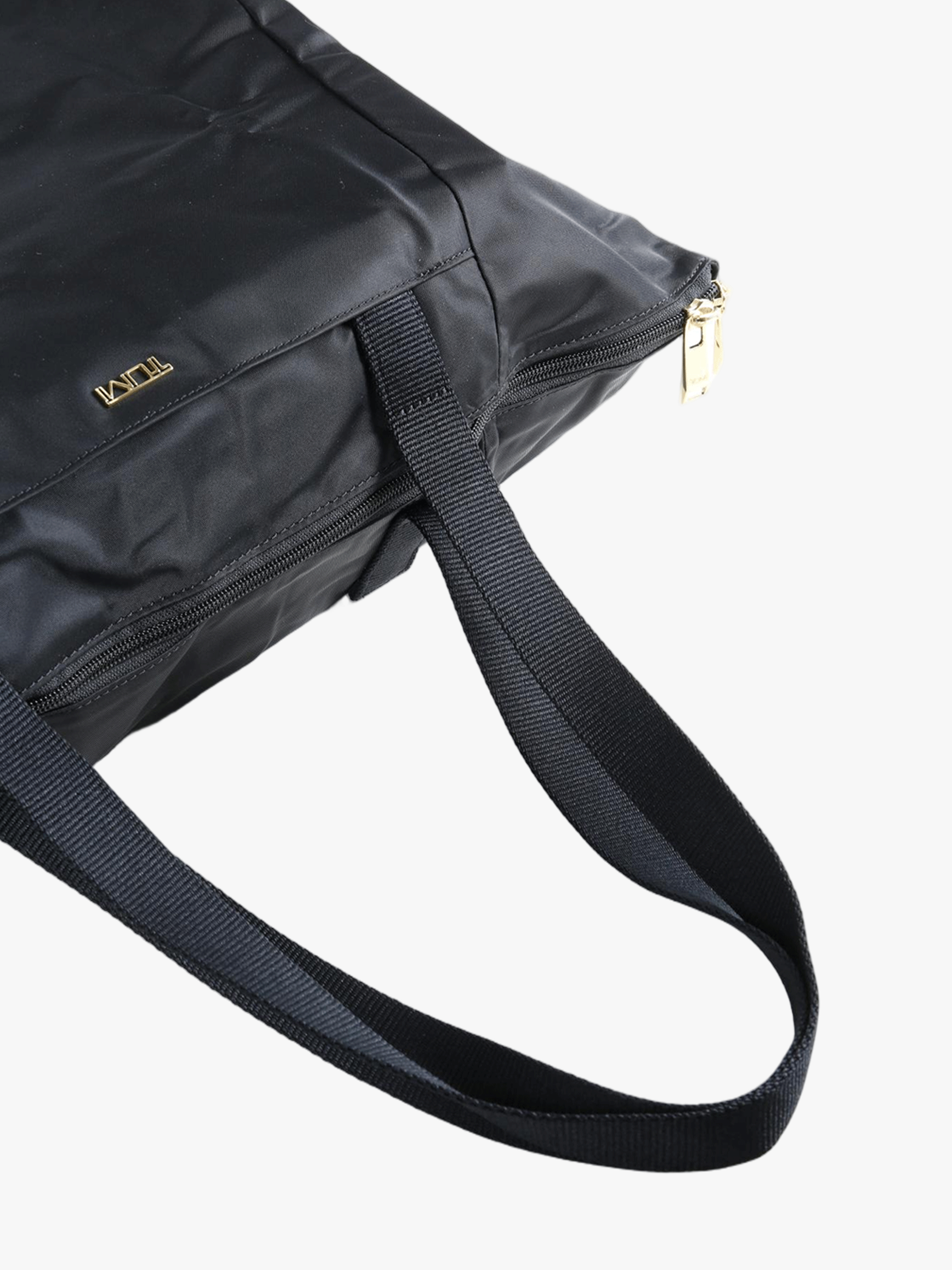Close up of black bag, showing texture of the nylon fabric